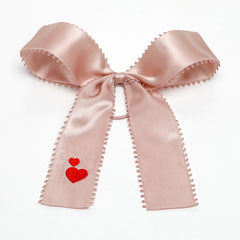 pink satin bow with red hearts